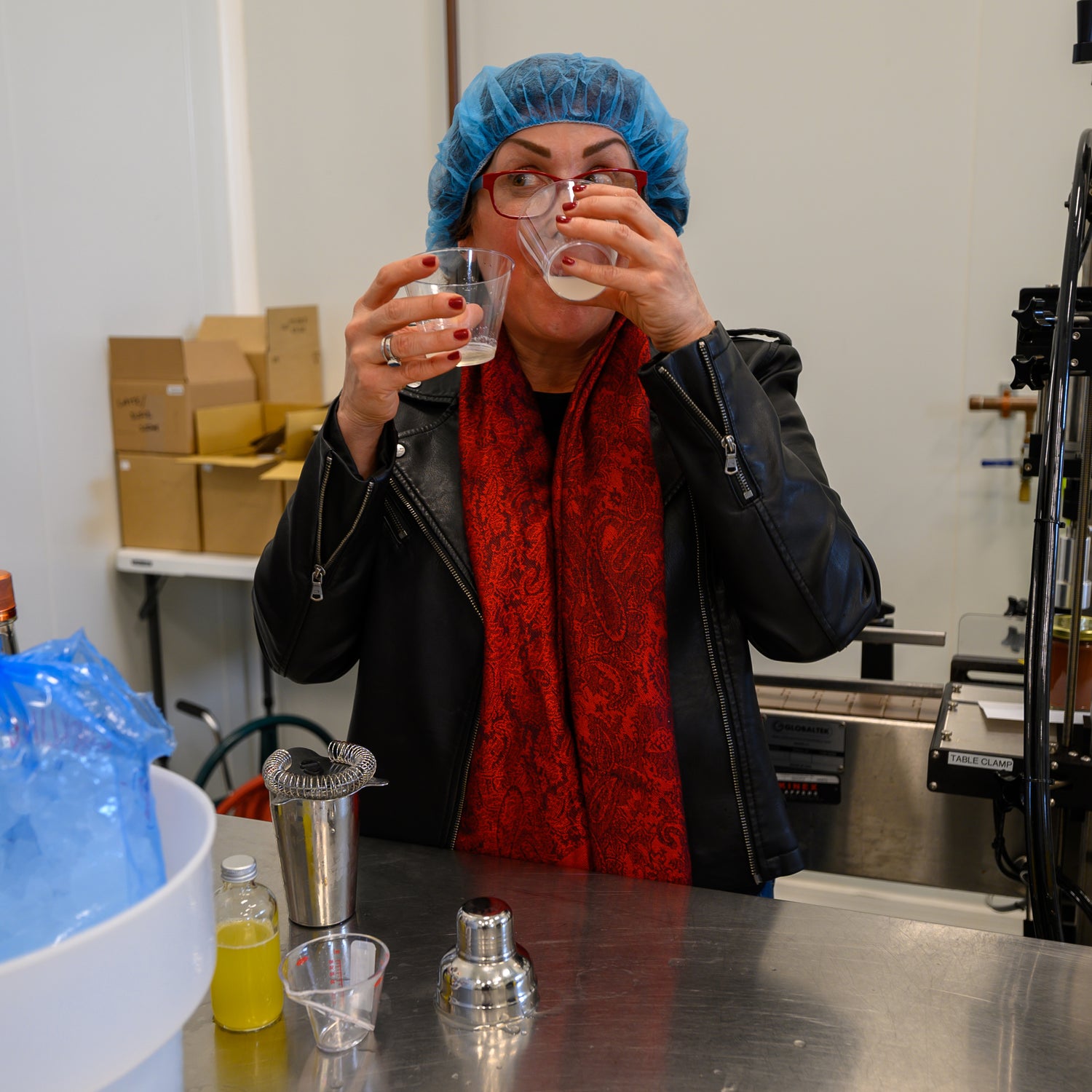 Gina Ghioldi sampling Cocktails In Hell Cocktail Mixer